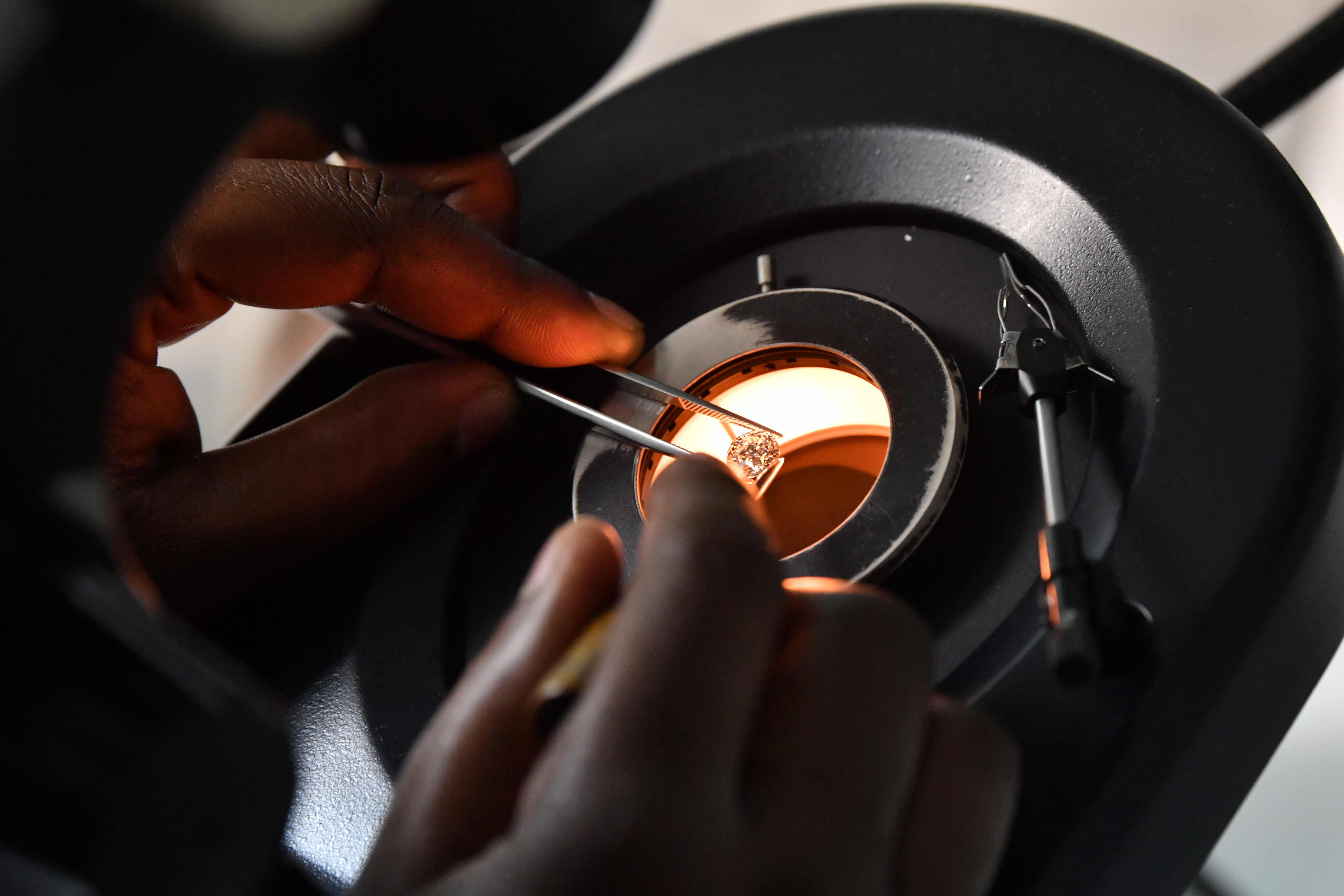 Close-up of jewelry crafting and metalwork process